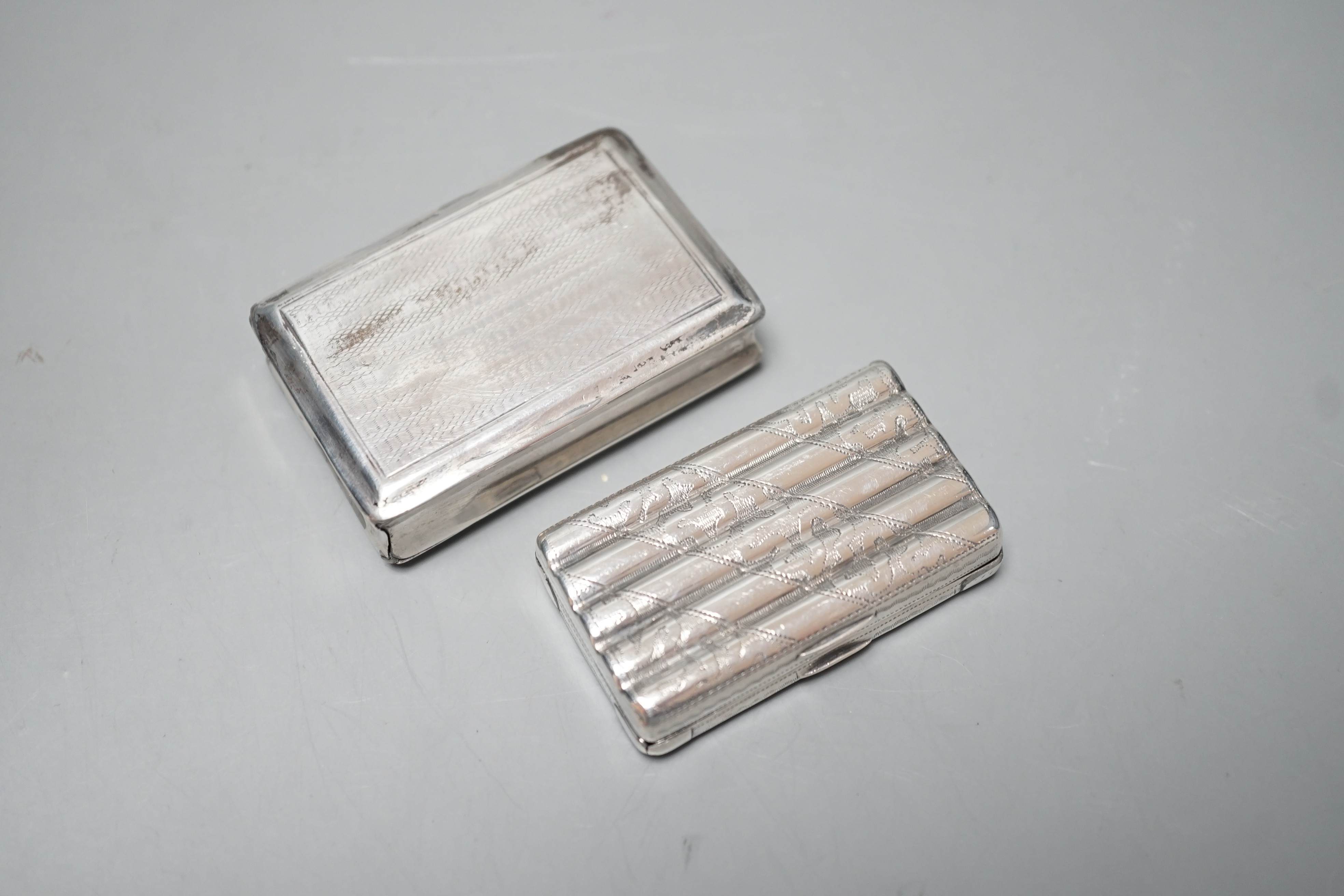 A George IV engine turned silver rectangular snuff box, Lawrence & Co, Birmingham, 1824, 59mm and an earlier ribbed silver snuff box by Thropp & Taylor, Birmingham, 1811, both a.f.
